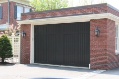 One Dark Green Garage Door